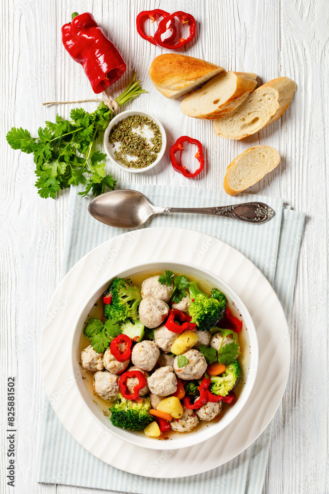 chicken meatball soup with vegetables in a bowl chicken meatball soup with vegetables in a bowl