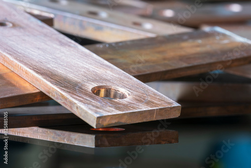 Copper flat busbar close-up, on metal surface