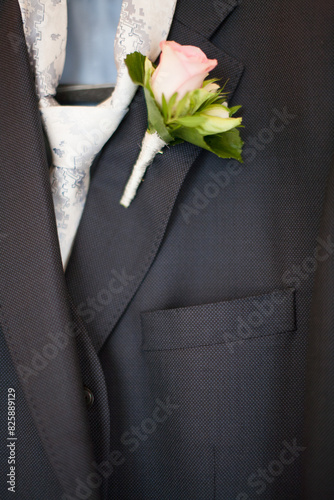 Elegant suit jacket with white rose boutonniere, perfect for weddings and formal events ideal for groom or attendee