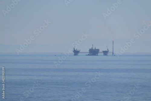 marine oil extraction platform in the morning fog - Prinos oil area, near Thassos, Greece, Aegean sea