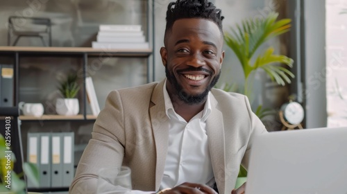 Joyful African American Businessman Working on Laptop in Office  4K Wallpaper  