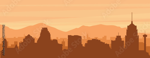 Brown panoramic poster of the city skyline with misty background buildings, sunrise, clouds and mountains of SAN ANTONIO, UNITED STATES