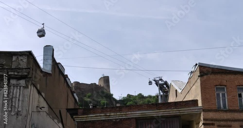 Cable car over the buildings of the old city in the historical part of Tbilisi, Georgia photo