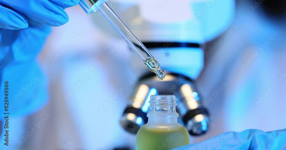Scientist in lab is researching cosmetic oil for skin rejuvenation Scientist in lab is researching cosmetic oil for skin rejuvenation