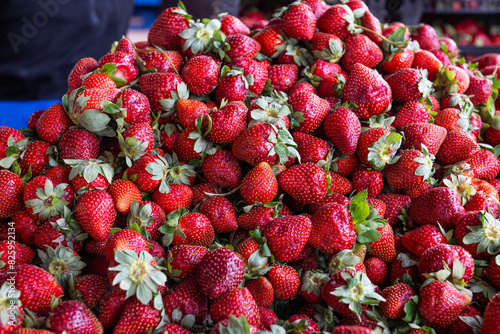 Lots of strawberries, fresh strawberries for sale. Strawberry in market close up.Colorful fruits, red strawberry, background.