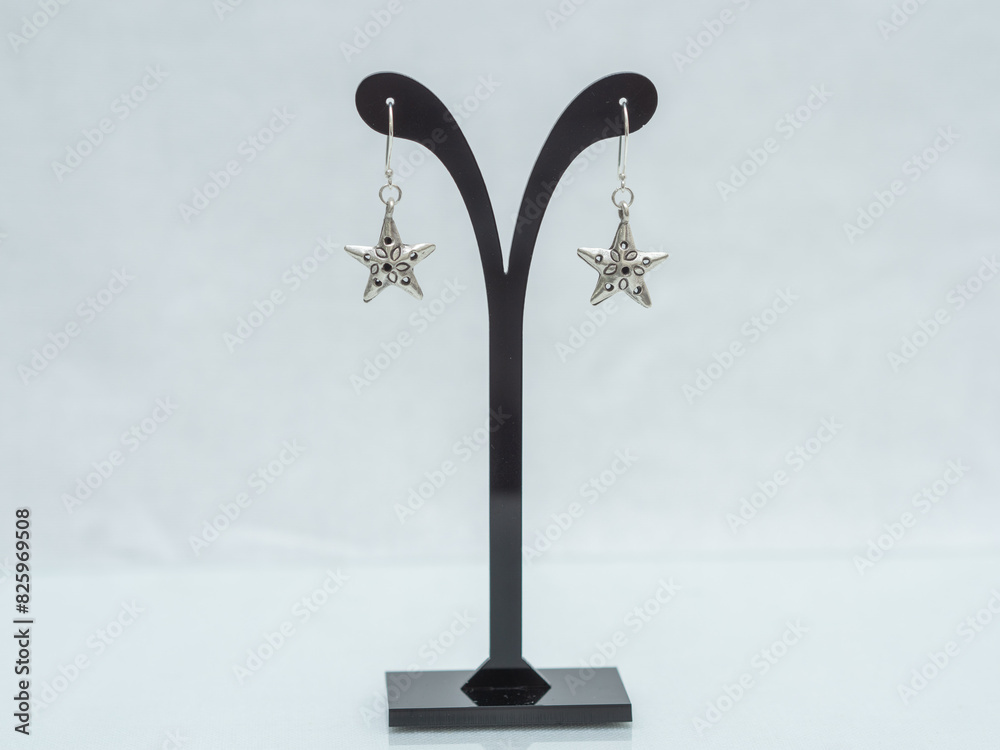 Silver jewelry, Handmade silver accessories display on white background Silver jewelry, Handmade silver accessories display on white background