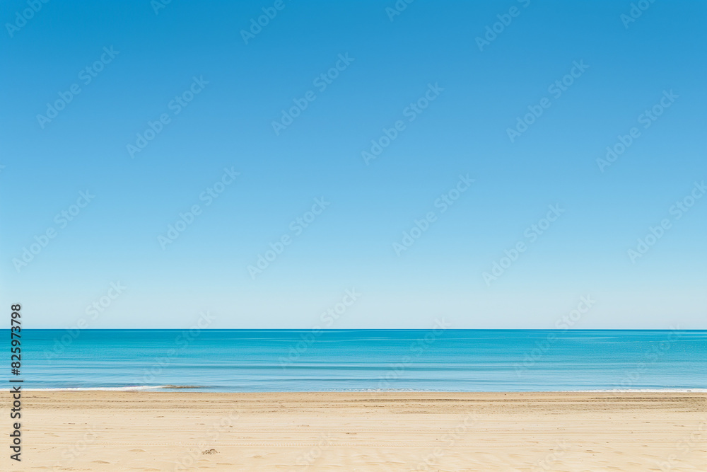 Fototapeta premium Sunlit Beach with Blue Sky and Ocean View