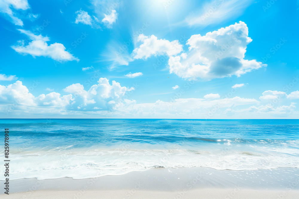 Obraz premium Sunlit Beach with Blue Sky and Ocean View