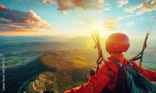 A paraglider hovering over a beautiful landscape photo