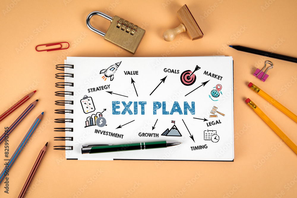 EXIT PLAN. Notepad and office supplies on a light background EXIT PLAN. Notepad and office supplies on a light background