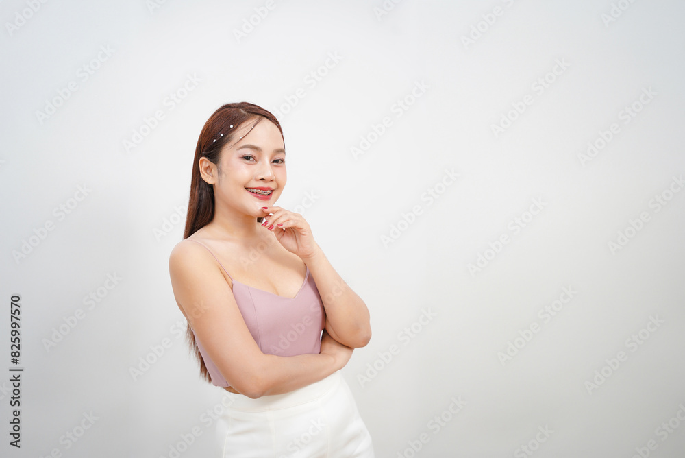 Smiling Asian Woman with Braces and Hand Near Face on White Background Smiling Asian Woman with Braces and Hand Near Face on White Background