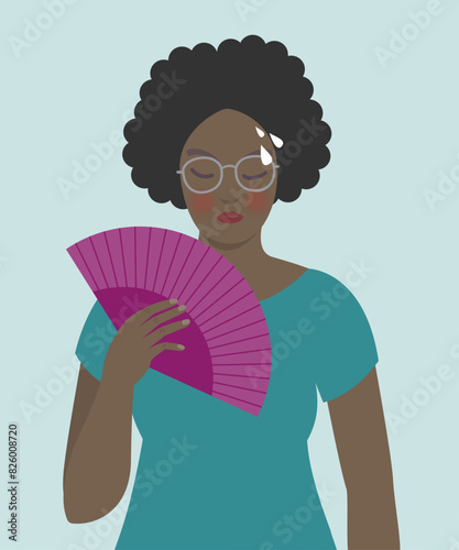 Woman cooling herself with fan, menopause symptoms, hot flashes.