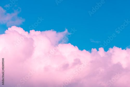 Magic pink cumulus clouds in blue sky, sunset, sunrise