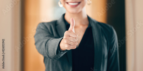 Hand, thumbs up and business woman show support, thank you and smile in office for success in agreement. Like, gesture and sign for feedback, review and vote winner with yes emoji on social media