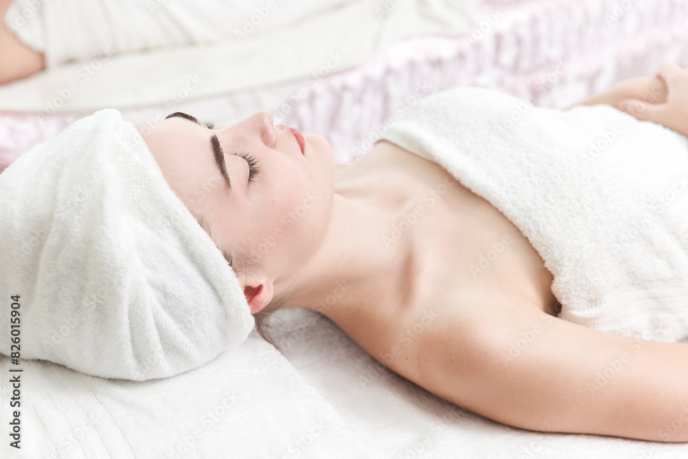 Woman Relaxing at Spa Treatment with Towel Wrapped Around Her Head Woman Relaxing at Spa Treatment with Towel Wrapped Around Her Head