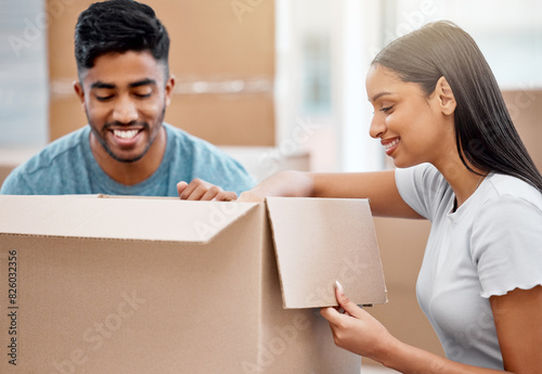 Couple, moving boxes and new home property for investment opportunity with real estate, milestone or future. Man, woman and happy in apartment packing for mortgage loan, immigration or relocation © peopleimages.com