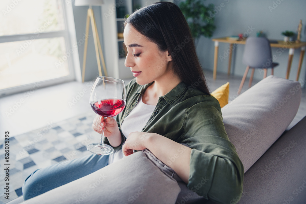 Photo of pretty young lady closed eyes smell wine wear green shirt weekend modern apartment indoors Photo of pretty young lady closed eyes smell wine wear green shirt weekend modern apartment indoors