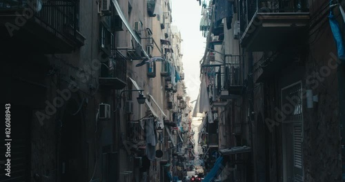 Narrow dark street Naples Italy Spanish quarter balcony laundry hangs