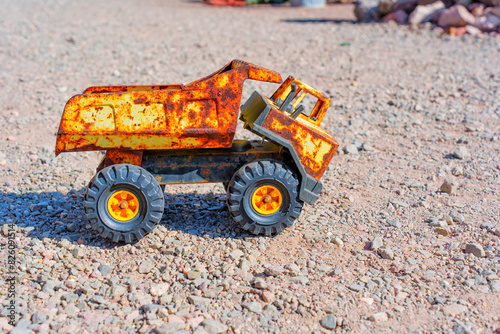 Toy Dump Truck On a Gravel Surface