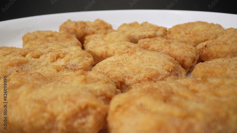 Nuggets are diminutive portions of sustenance, typically composed of minced meat or vegetables, esteemed for their convenience and delectable flavor profile. Food concept. Fast-food background.
Nuggets are diminutive portions of sustenance, typically composed of minced meat or vegetables, esteemed for their convenience and delectable flavor profile. Food concept. Fast-food background.