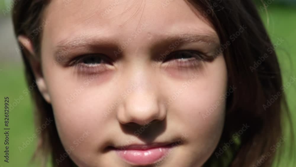 A beautiful brunette girl 8-10 years old, or a teenager, stands on the street in the sun and smiles looking at the camera , her hair flutters in the wind, the concept of a happy childhood and future A beautiful brunette girl 8-10 years old, or a teenager, stands on the street in the sun and smiles looking at the camera , her hair flutters in the wind, the concept of a happy childhood and future