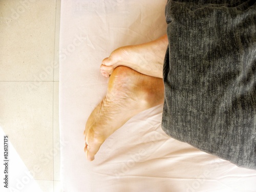 Close up of a woman feet on bed