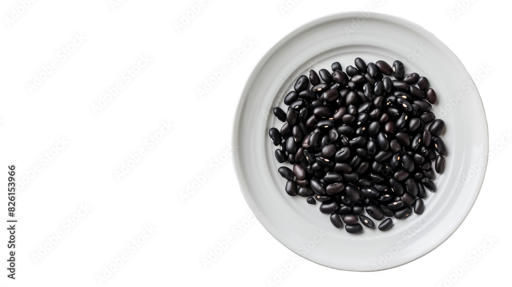 A white bowl filled with black beans sitting on a clean white table A white bowl filled with black beans sitting on a clean white table