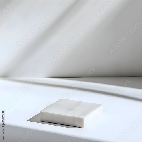 A minimalist white background with shadows and marble white pedestal. 