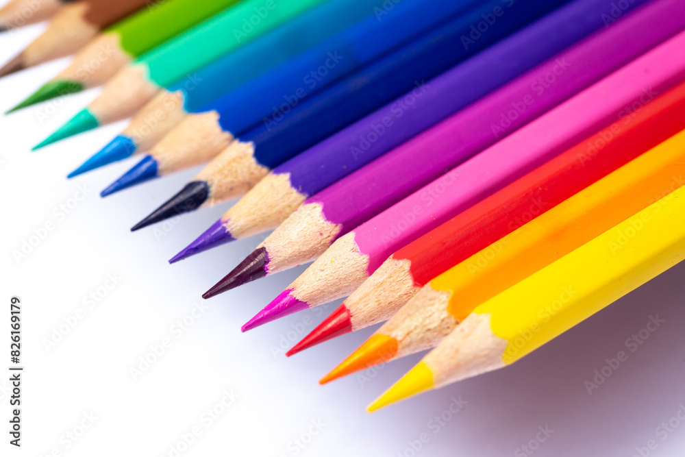Color pencils that have been sharpened Arranged together according to the hues of the rainbow and photographed close-up. Isolated on a white background Color pencils that have been sharpened Arranged together according to the hues of the rainbow and photographed close-up. Isolated on a white background