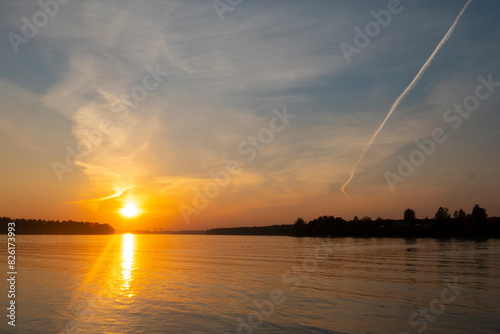 Obraz na płótnie Sunset by river with tree silhouette. High quality photo w salonie