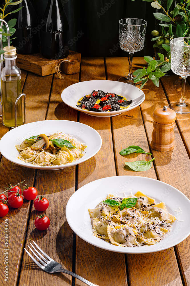 Gourmet italian pasta dishes on rustic wooden table Gourmet italian pasta dishes on rustic wooden table