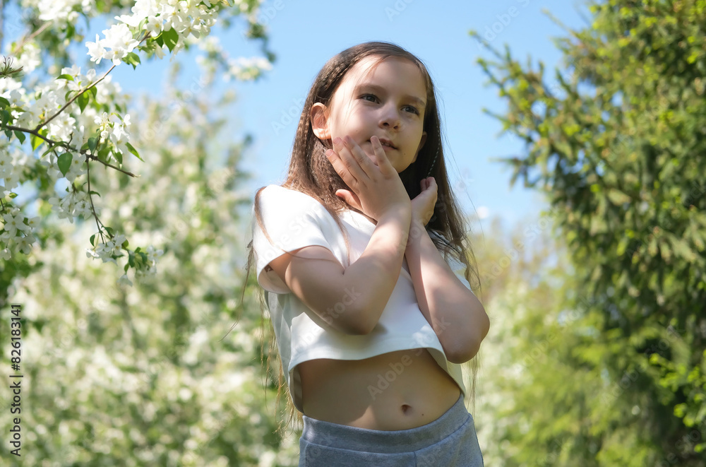Inspired beautiful girl dancing in a sunny park in summer. Outdoor entertainment. Selective focus. Inspired beautiful girl dancing in a sunny park in summer. Outdoor entertainment. Selective focus.