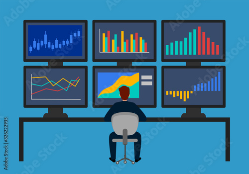 Businessman or stock market trader working at desk with six monitor showing data.
