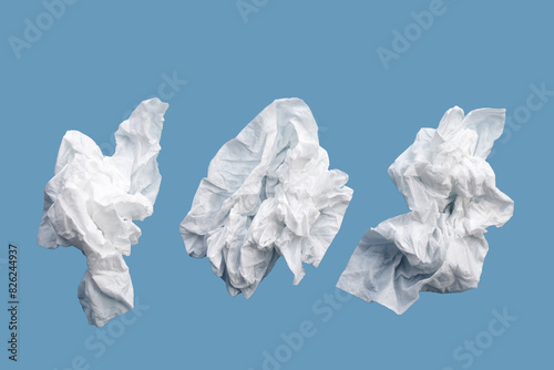 Facial tissue on blue background.