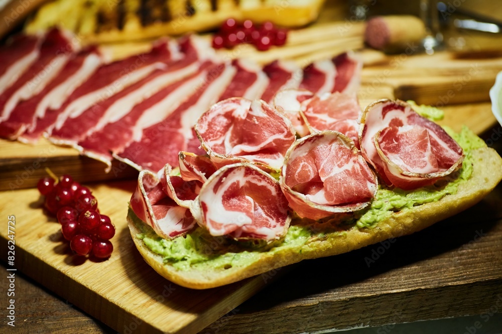 Sandwiches made of guacamole and dried meat on bread. Avocado and meat dish Sandwiches made of guacamole and dried meat on bread. Avocado and meat dish