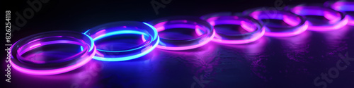 A row of neon colored rings with a blue and purple hue