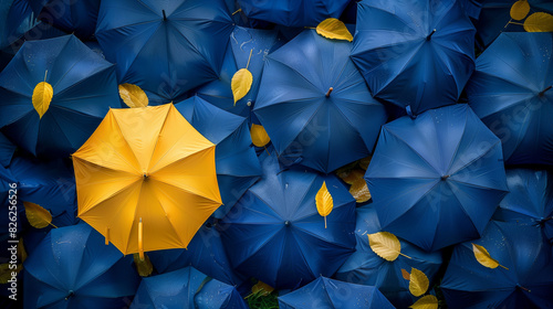 'Unique umbrella in a crowd of similar ones' photo