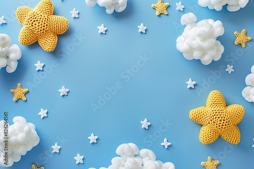 Gender neutral baby stuff. Little baby sleep accessories. Knitted toy yellow stars, white clouds on blue background. Flat lay top view. Newborn sleeping rules. Content for children products. Kids room