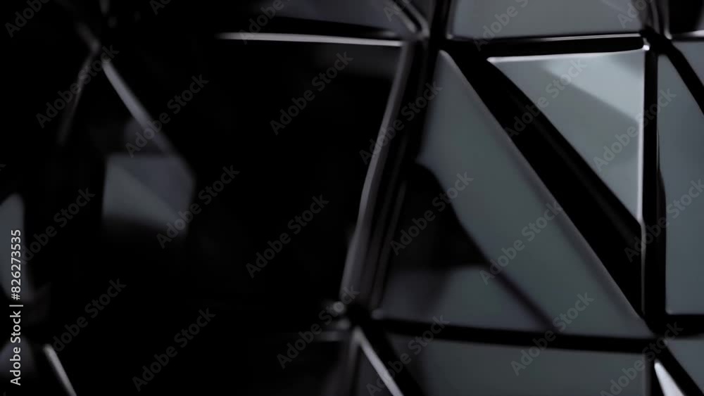 close-up of a background made entirely of black glossy triangular 3D tiles seamlessly connecting to each other, reflecting light to create subtle highlights and shadows