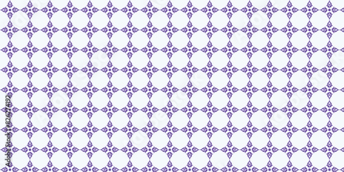 Seamless pattern with purple floral motifs on a white background