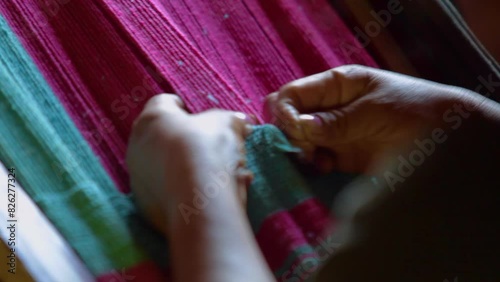 Indigenous woman weaving a blanket photo