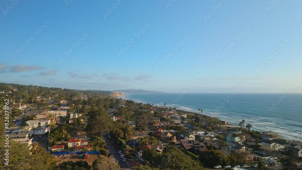 Aerial shot showing houses next to the ocean. Aerial shot showing houses next to the ocean.