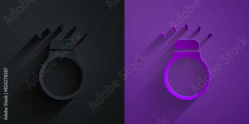 Paper cut Diamond ring icon isolated on black on purple background. Paper art style. Vector