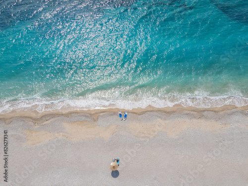 Aerial view of a sandy beach with turquoise water