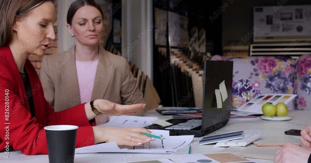 Woman designer seals deal with client with firm handshake. Smiling female team marks culmination of weeks of hard work and negotiations with customer, innovative ideas, collaborative environment. Woman designer seals deal with client with firm handshake. Smiling female team marks culmination of weeks of hard work and negotiations with customer, innovative ideas, collaborative environment.