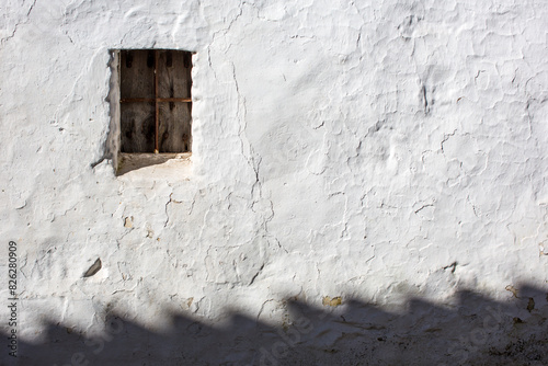 Whitewashed Wall With Window in Afternoon Light, Villaviciosa De Cordoba photo