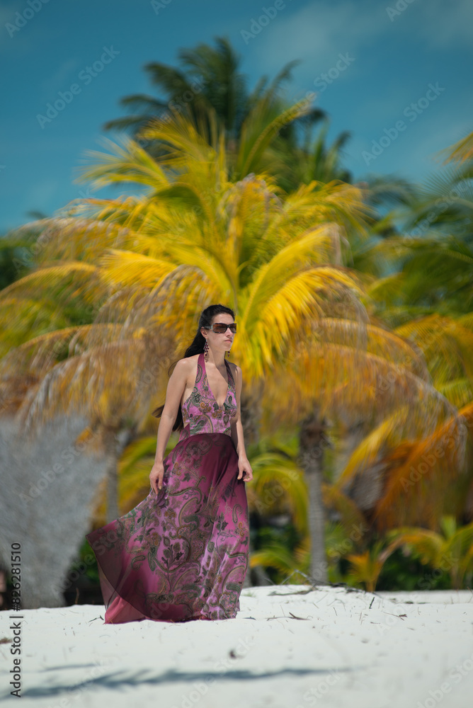 a girl in a dress and hat walks along the white sand among palm trees, dance siren in Cuba, Caribbean sea, palm trees on the beach a girl in a dress and hat walks along the white sand among palm trees, dance siren in Cuba, Caribbean sea, palm trees on the beach