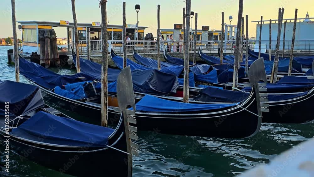 Gondolas on the quay dancing on the waves Gondolas on the quay dancing on the waves