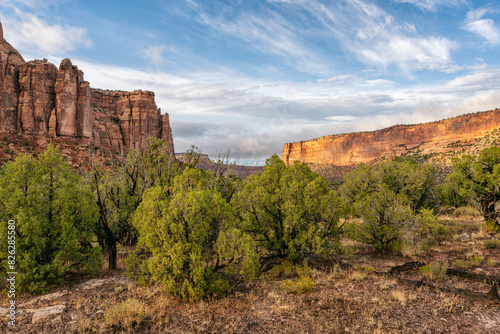 Scenic landscape of Colorado Monument during sunset with rugged cliffs