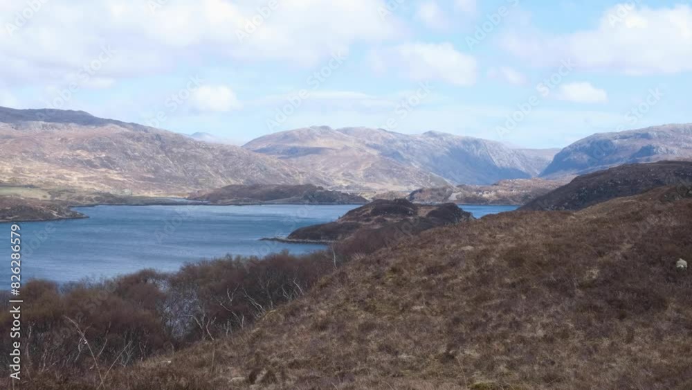 Panoramic landscape view of Loch Gleann Dubh with mountainous terrain in the remote outdoor wilderness of the highlands of Scotland UK Panoramic landscape view of Loch Gleann Dubh with mountainous terrain in the remote outdoor wilderness of the highlands of Scotland UK